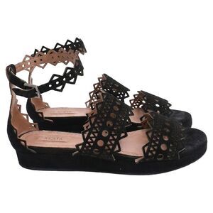 Alaïa Laser Cut Open Toe Flat Sandals in Black Suede